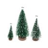 Fenyőfa dekor, havas zöld, fa talpon, kicsi 7cm 